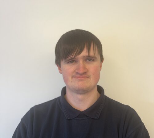 Headshot of a man in a Terry Lifts shirt